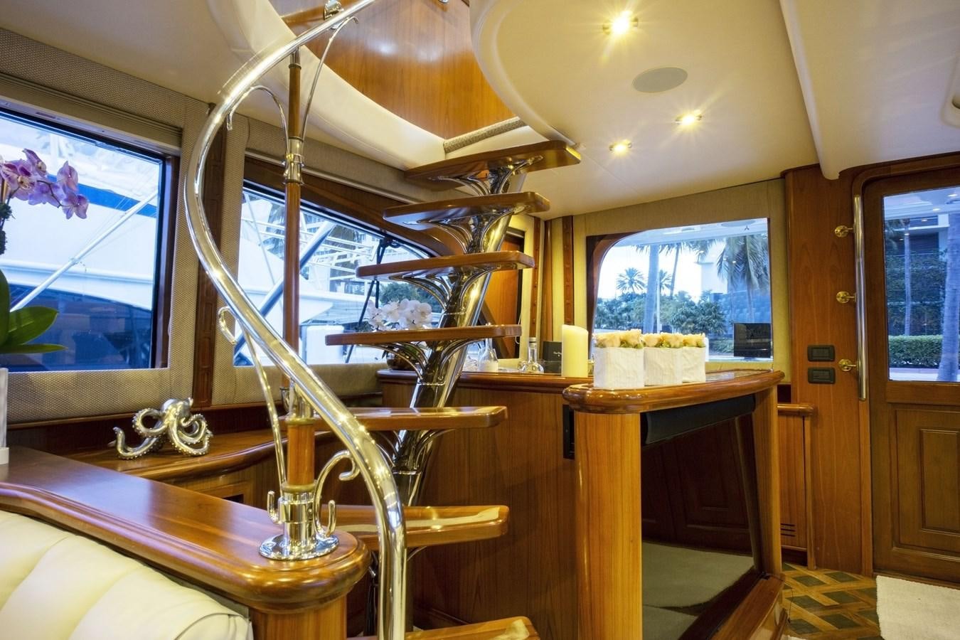 a room with a table and chairs aboard REEL DEAL Yacht for Sale