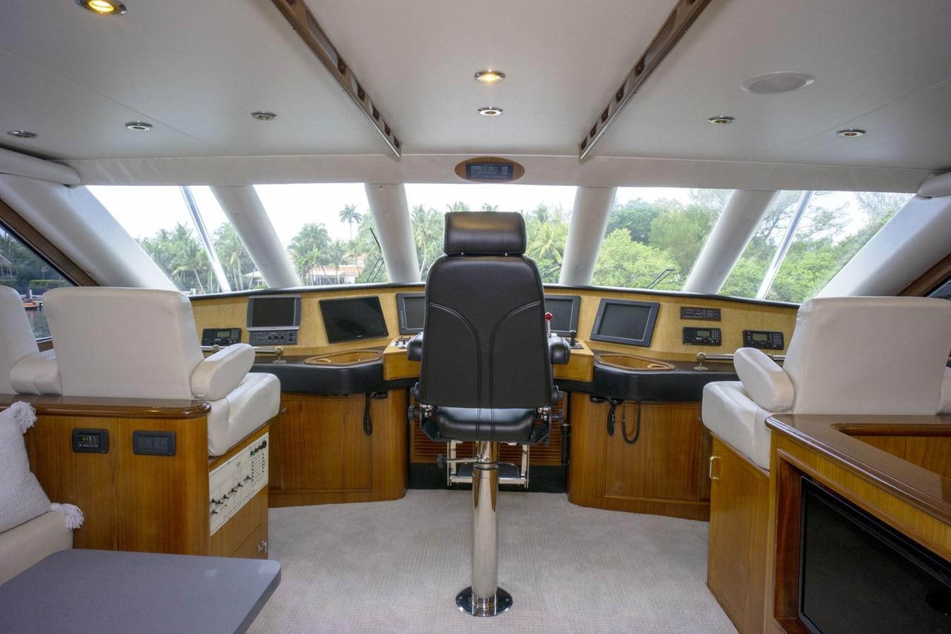 a room with a chair and desk aboard REEL DEAL Yacht for Sale