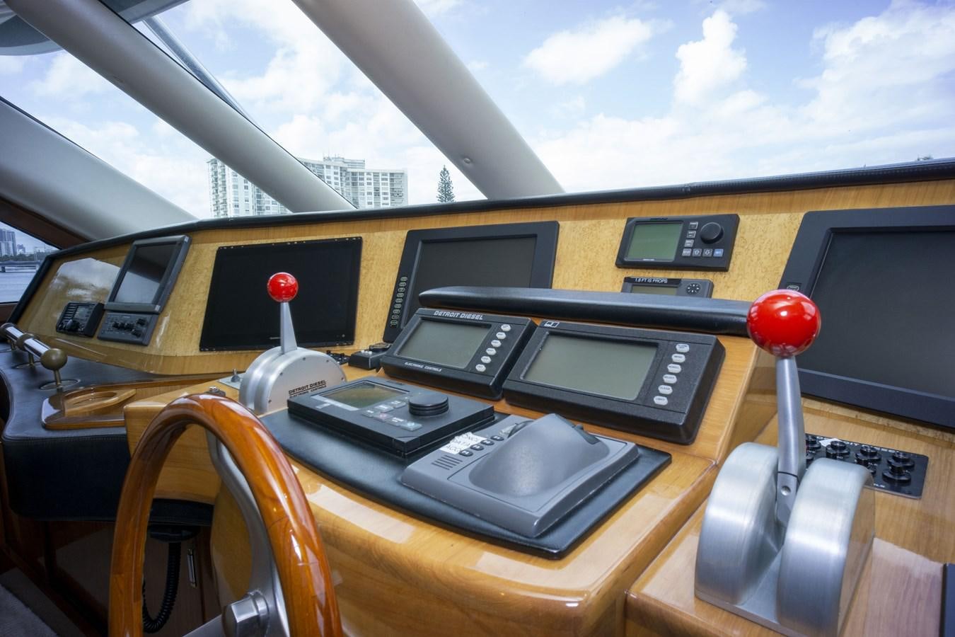 inside of a yellow car aboard REEL DEAL Yacht for Sale