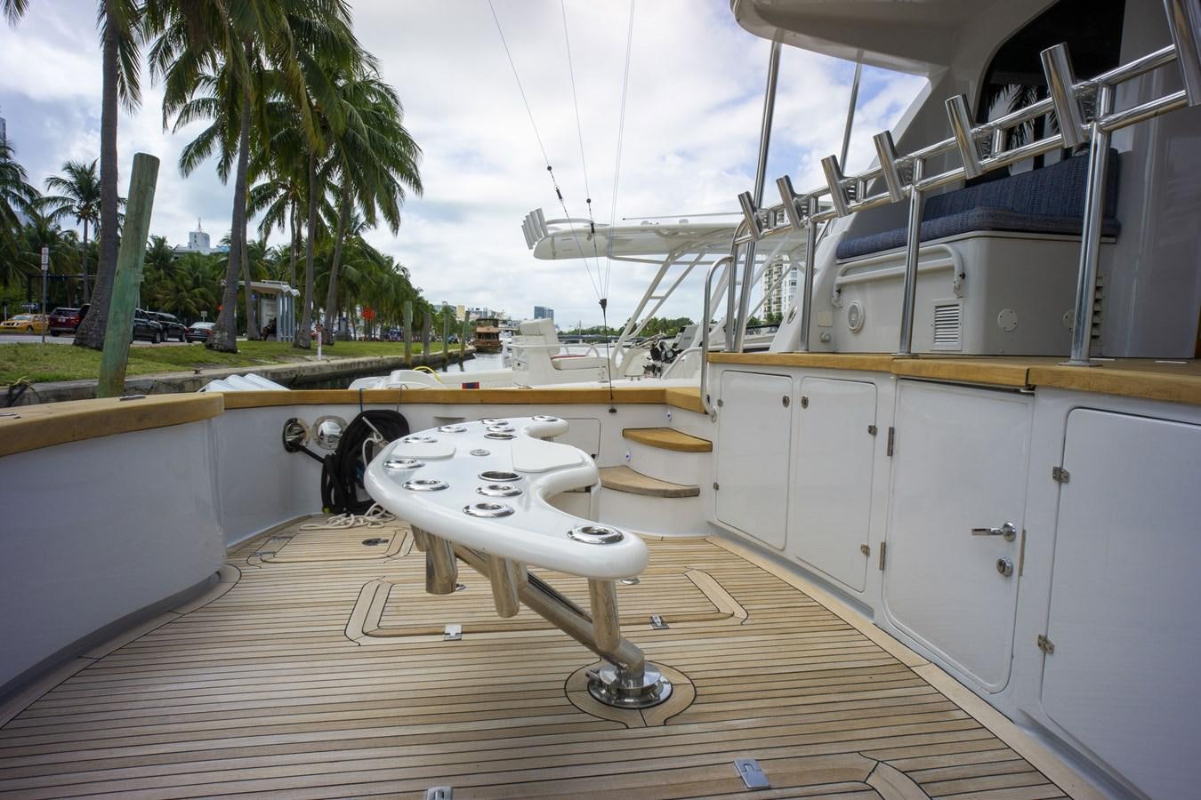 a large white machine on a wooden deck aboard REEL DEAL Yacht for Sale