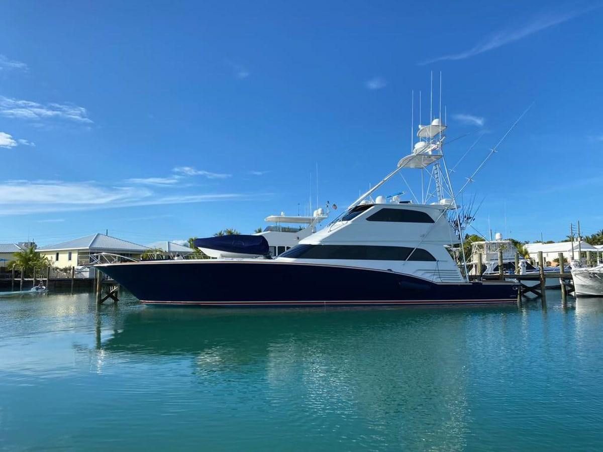 a boat docked at a pier aboard REEL DEAL Yacht for Sale
