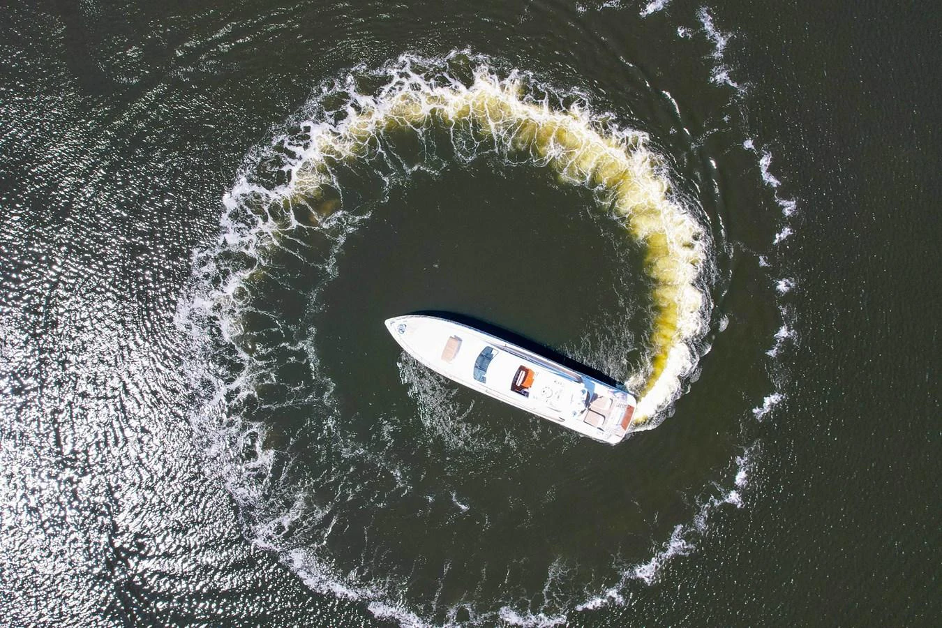a white car on a road aboard 108' MANGUSTA 2002 Yacht for Sale