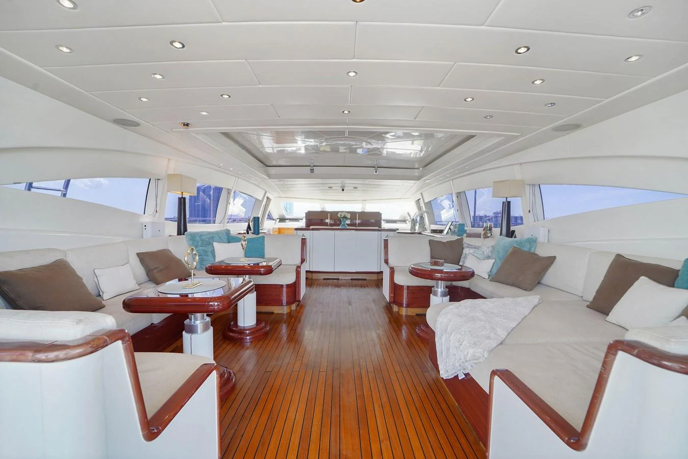 a room with a couch and a table aboard 108' MANGUSTA 2002 Yacht for Sale