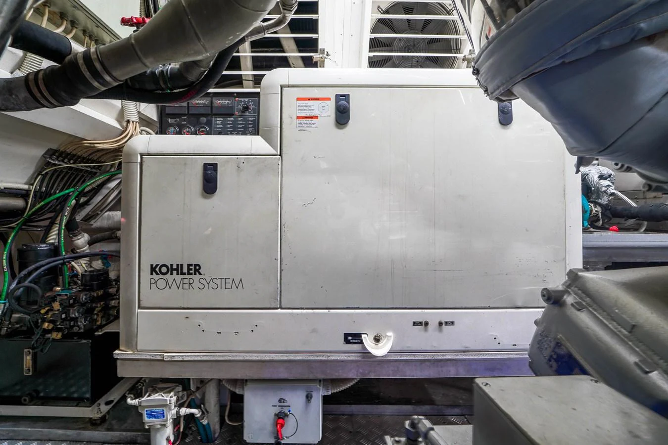 a large metal box with a red label on it aboard 108' MANGUSTA 2002 Yacht for Sale