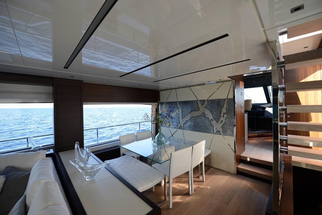 a room with a table and chairs aboard ELLIE JAMES Yacht for Sale