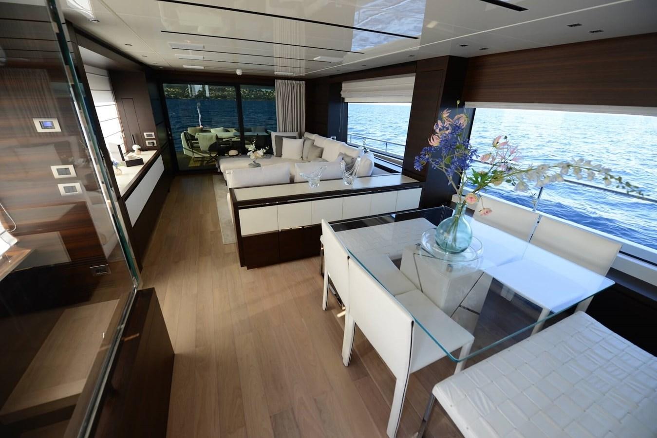 a room with a table and couches aboard ELLIE JAMES Yacht for Sale