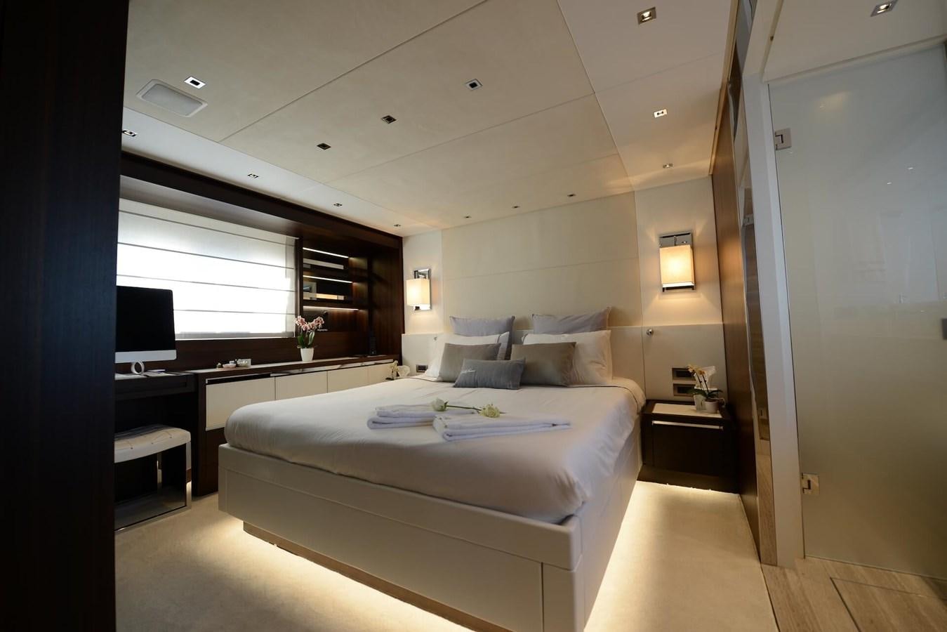 a bedroom with a bed and desk aboard ELLIE JAMES Yacht for Sale
