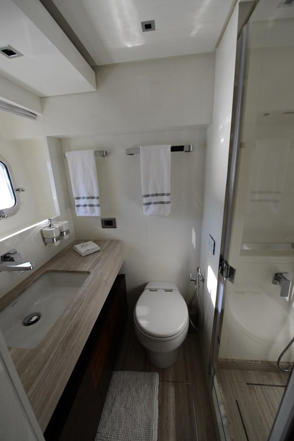 a bathroom with a sink toilet and bathtub aboard ELLIE JAMES Yacht for Sale