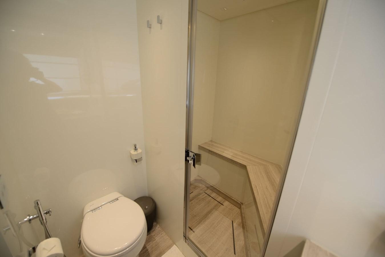 a bathroom with a toilet and a bathtub aboard ELLIE JAMES Yacht for Sale