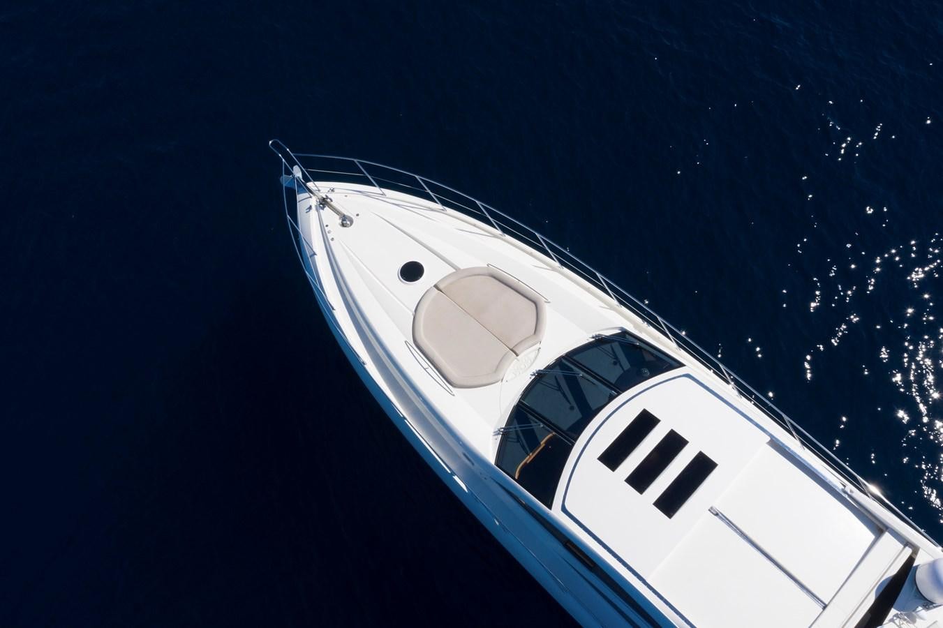 a white boat in the water aboard NUTS Yacht for Sale