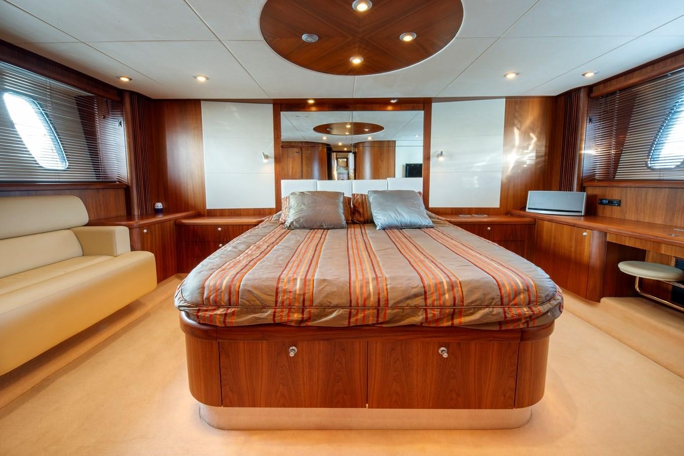 a bed in a room aboard NUTS Yacht for Sale