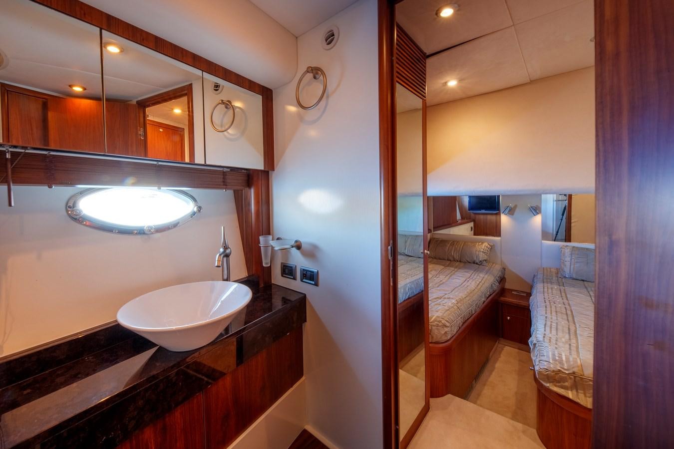 a bathroom with a sink and a mirror aboard NUTS Yacht for Sale