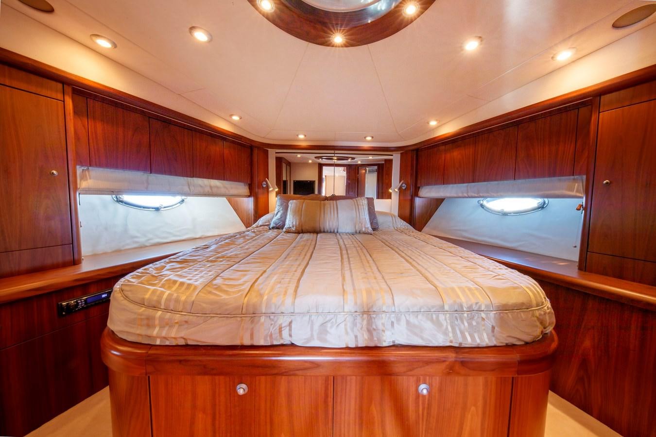 a room with wooden furniture aboard NUTS Yacht for Sale