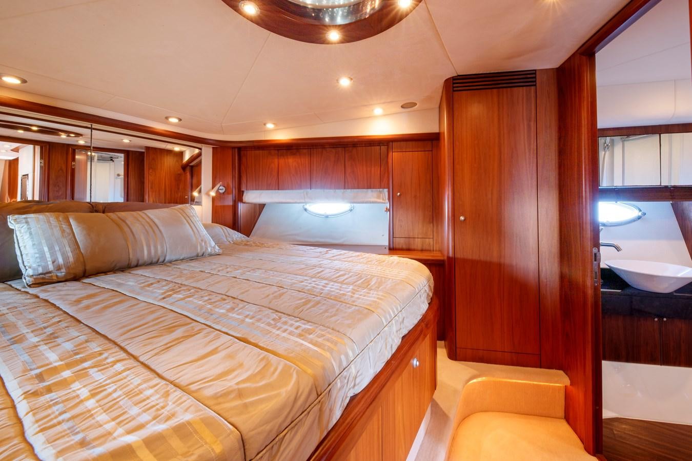a bed in a room aboard NUTS Yacht for Sale
