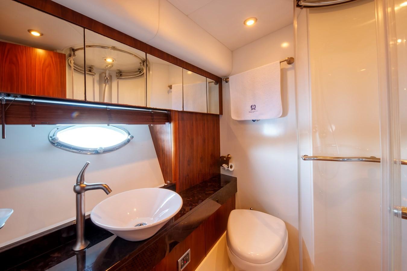 a bathroom with a sink and toilet aboard NUTS Yacht for Sale