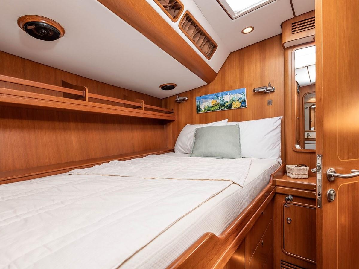 a bed in a cabin aboard VENTUROUS Yacht for Sale