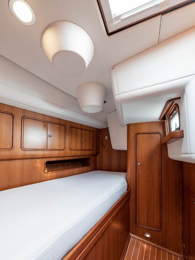 a room with wooden cabinets aboard VENTUROUS Yacht for Sale