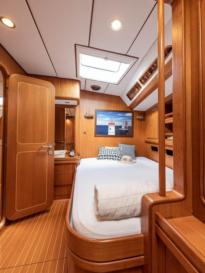 a bed in a cabin aboard VENTUROUS Yacht for Sale