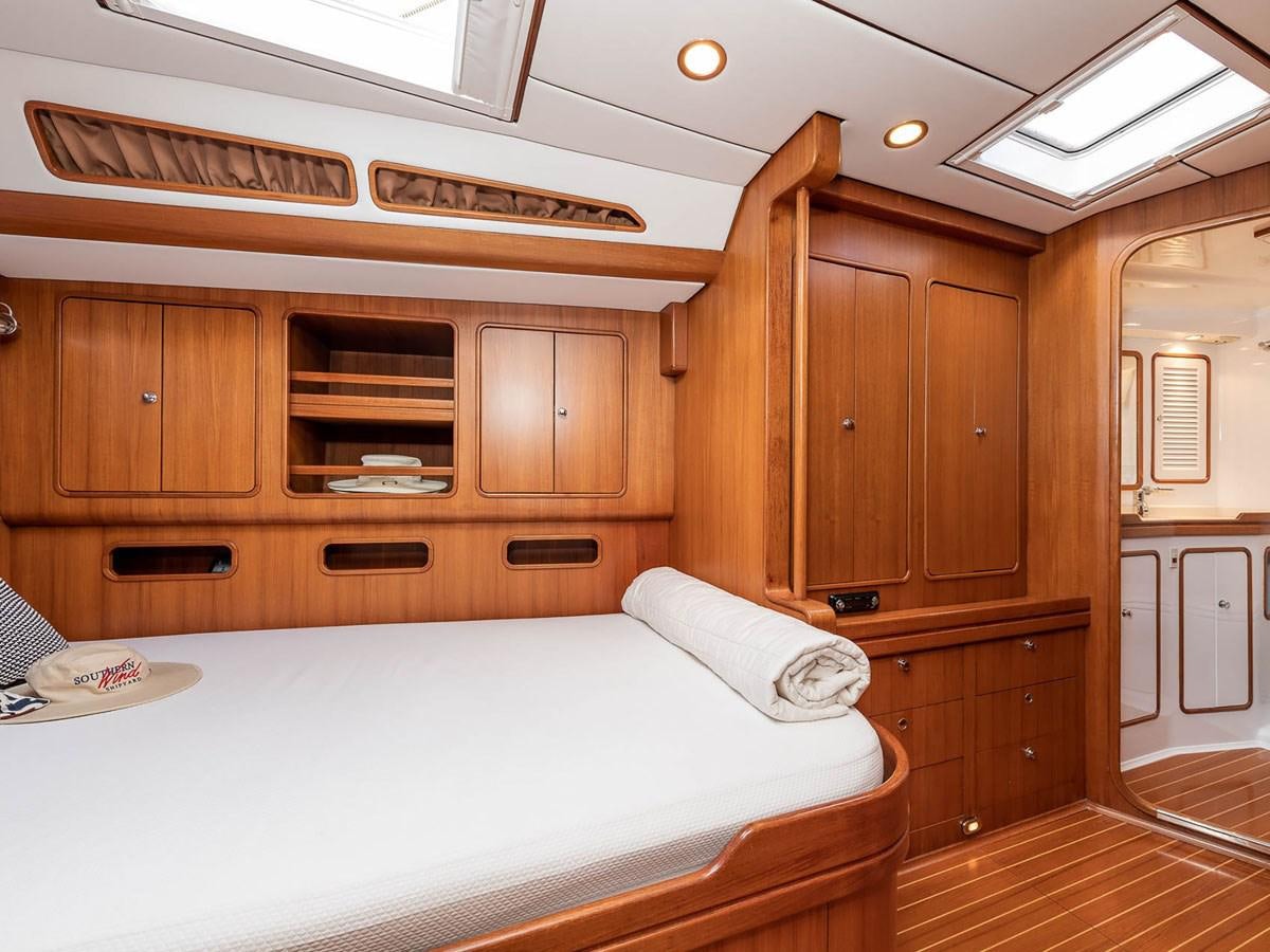 a bed in a room aboard VENTUROUS Yacht for Sale
