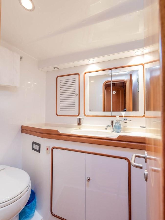 a bathroom with a sink and a toilet aboard VENTUROUS Yacht for Sale