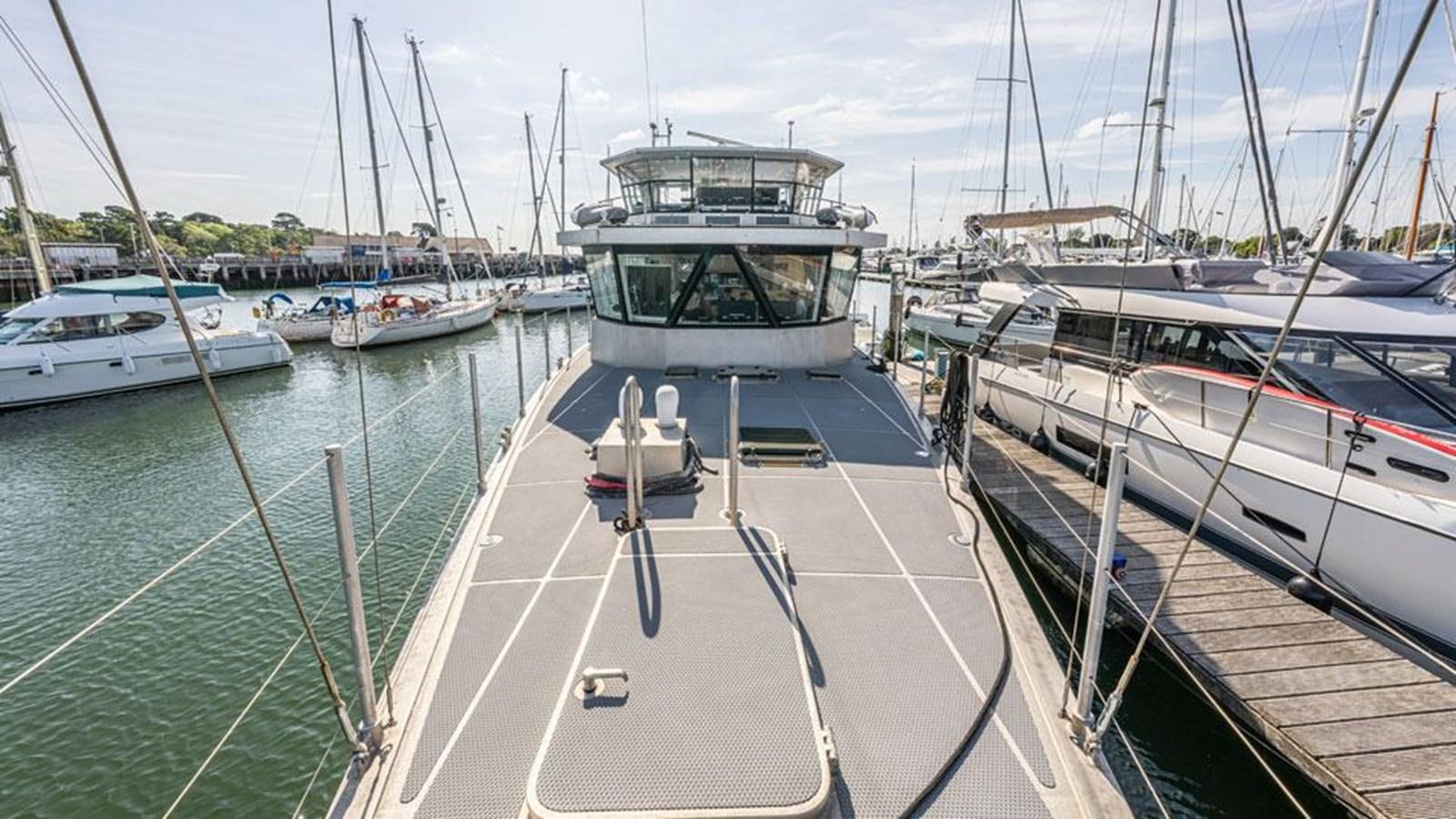 a group of boats are parked in a harbor aboard GREY WOLF Yacht for Sale