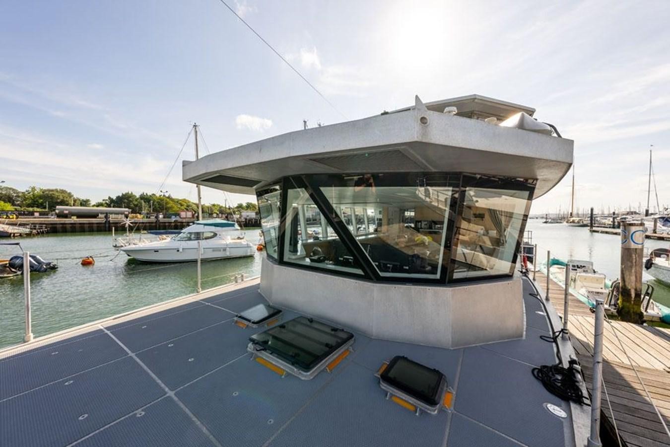a boat docked at a pier aboard GREY WOLF Yacht for Sale