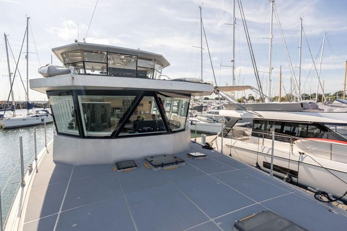 a boat docked at a pier aboard GREY WOLF Yacht for Sale