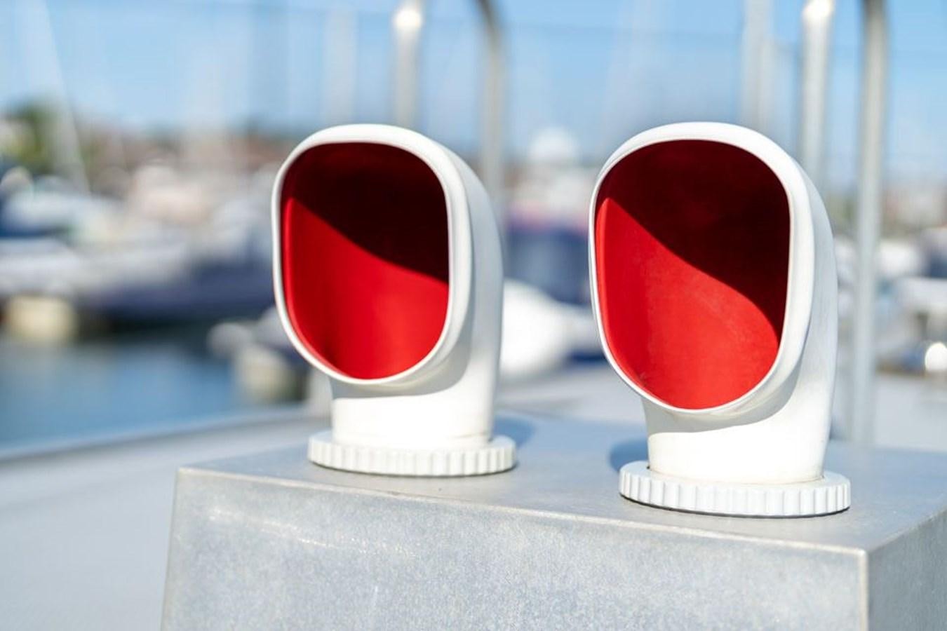 a glass of red liquid on a table aboard GREY WOLF Yacht for Sale