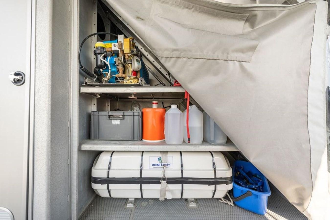 a white shelf with tools and other objects on it aboard GREY WOLF Yacht for Sale