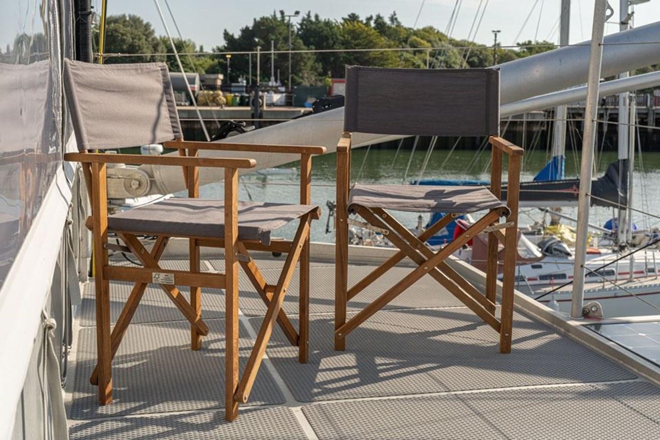 a wooden structure with a chair on it aboard GREY WOLF Yacht for Sale