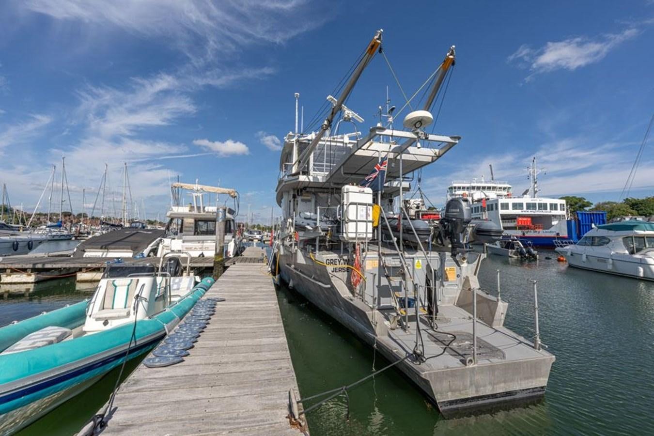 a dock with boats aboard GREY WOLF Yacht for Sale