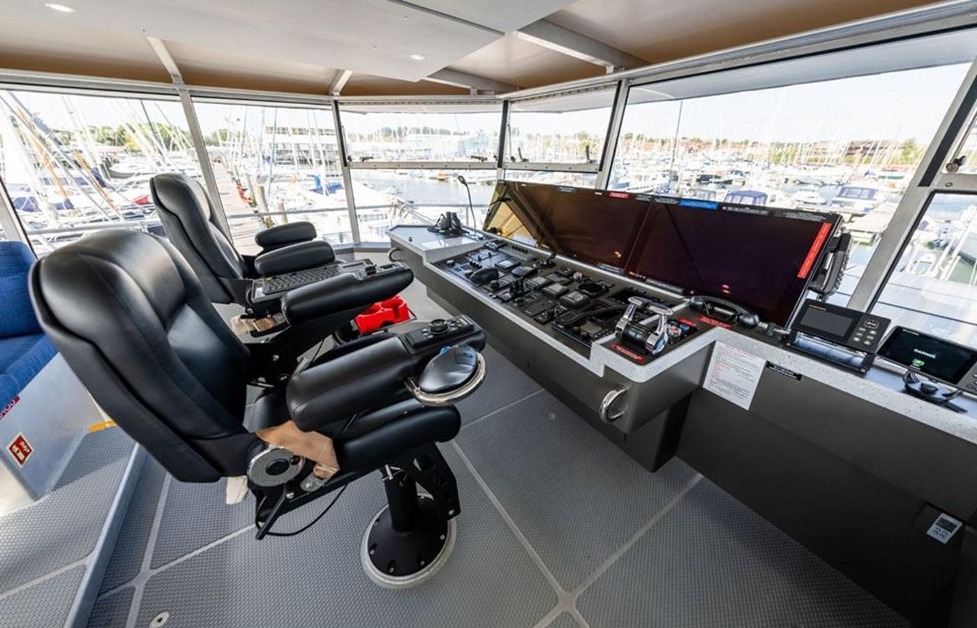 a black and white piano in a car aboard GREY WOLF Yacht for Sale