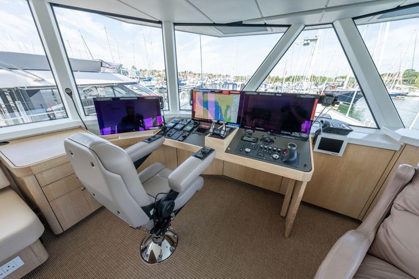 a room with a desk and a chair and a computer aboard GREY WOLF Yacht for Sale