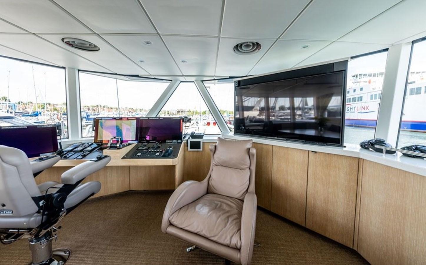 a room with a desk and chairs aboard GREY WOLF Yacht for Sale