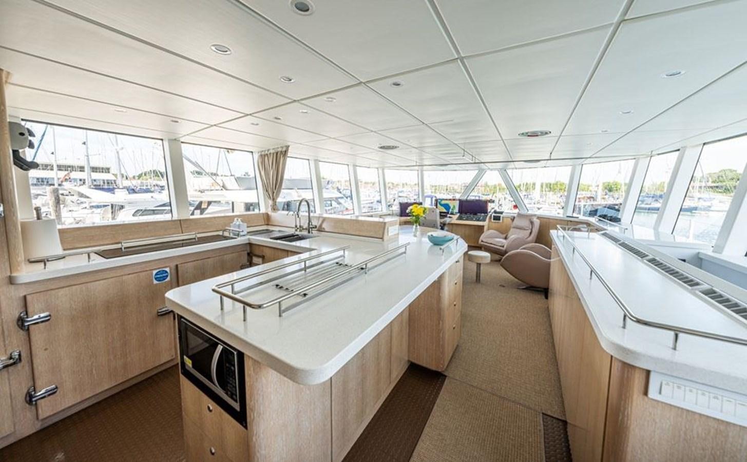inside of a building with a table and chairs aboard GREY WOLF Yacht for Sale