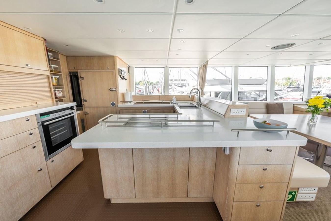 a kitchen with a large island aboard GREY WOLF Yacht for Sale