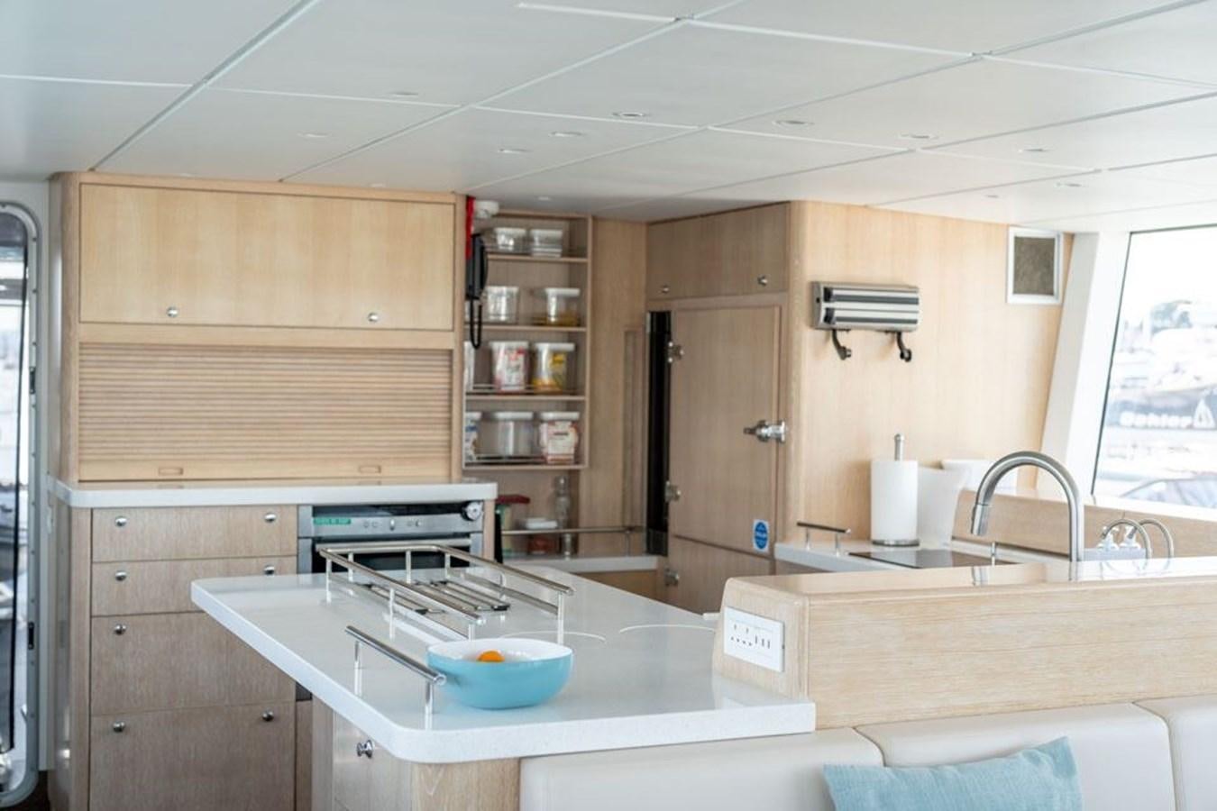 a kitchen with a sink and cabinets aboard GREY WOLF Yacht for Sale