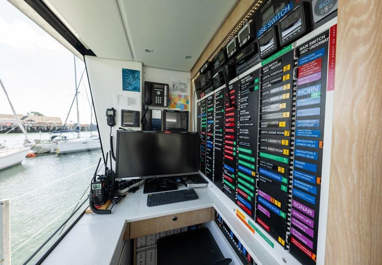 a computer monitor and keyboard on a table aboard GREY WOLF Yacht for Sale