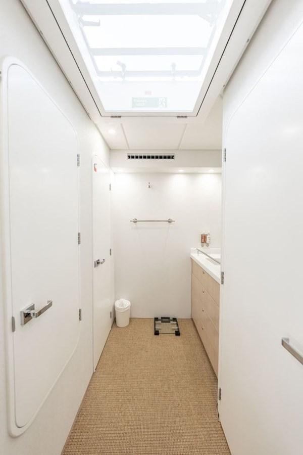 a hallway with white doors aboard GREY WOLF Yacht for Sale