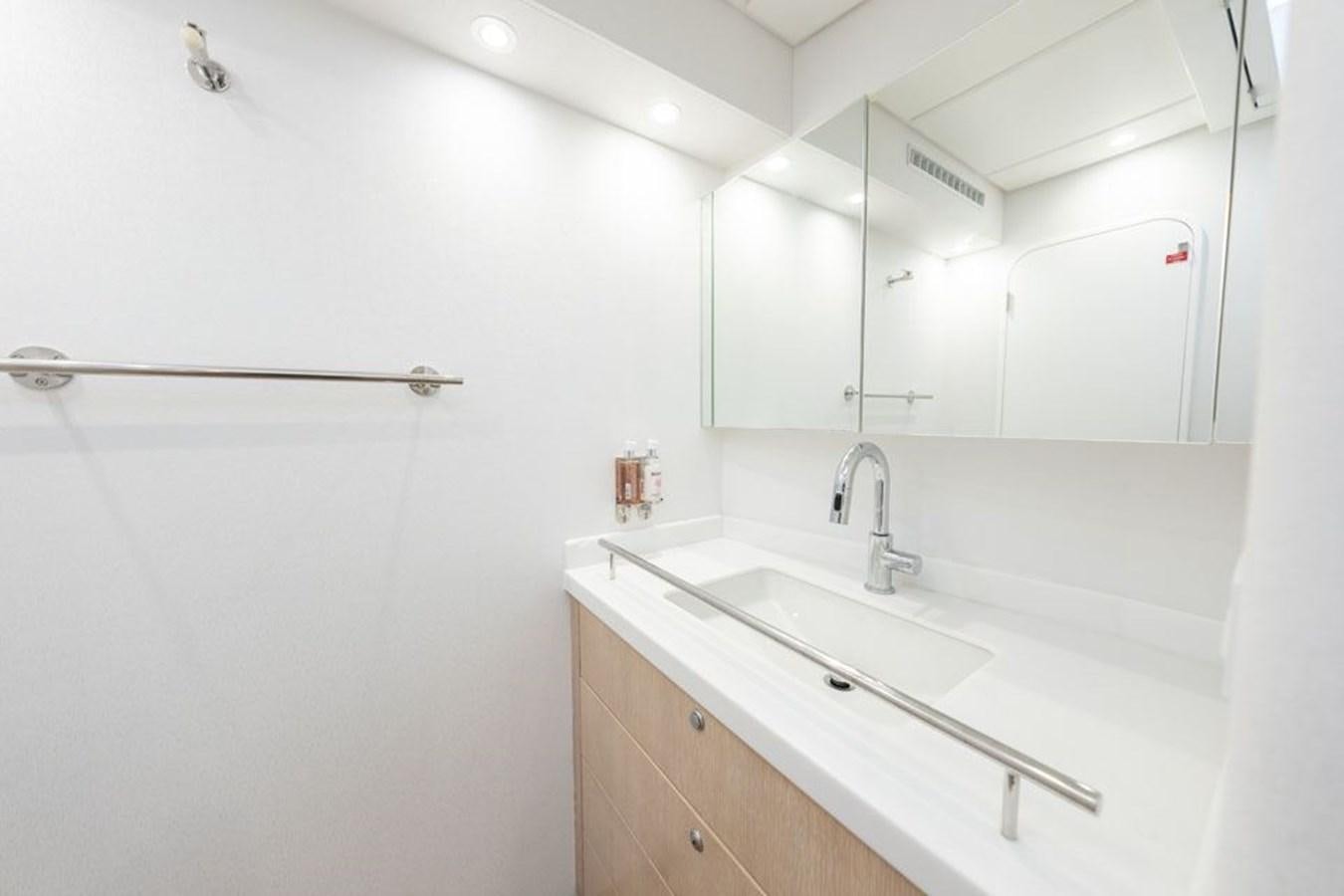 a bathroom with white walls aboard GREY WOLF Yacht for Sale