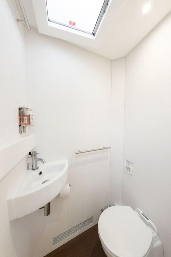 a small bathroom with a toilet aboard GREY WOLF Yacht for Sale