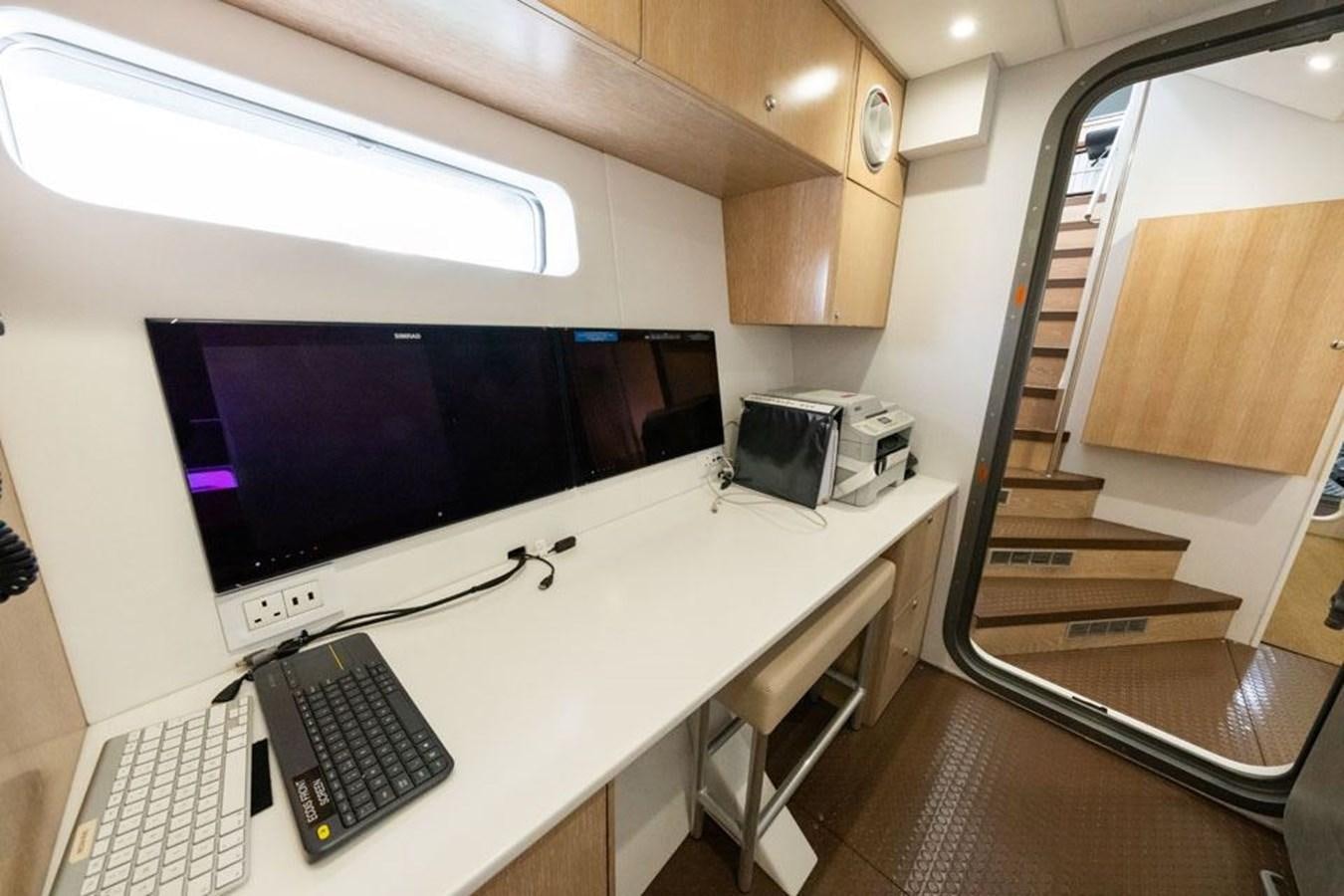 a computer on a desk aboard GREY WOLF Yacht for Sale