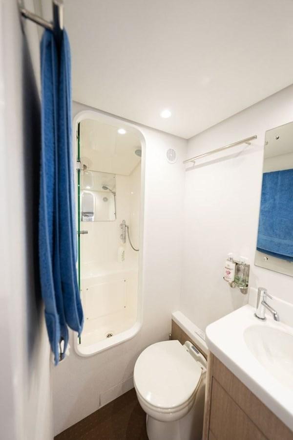 a bathroom with a toilet and sink aboard GREY WOLF Yacht for Sale