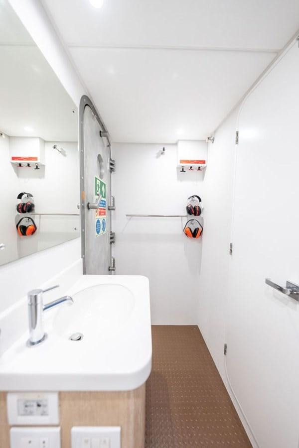 a bathroom with a sink and a mirror aboard GREY WOLF Yacht for Sale