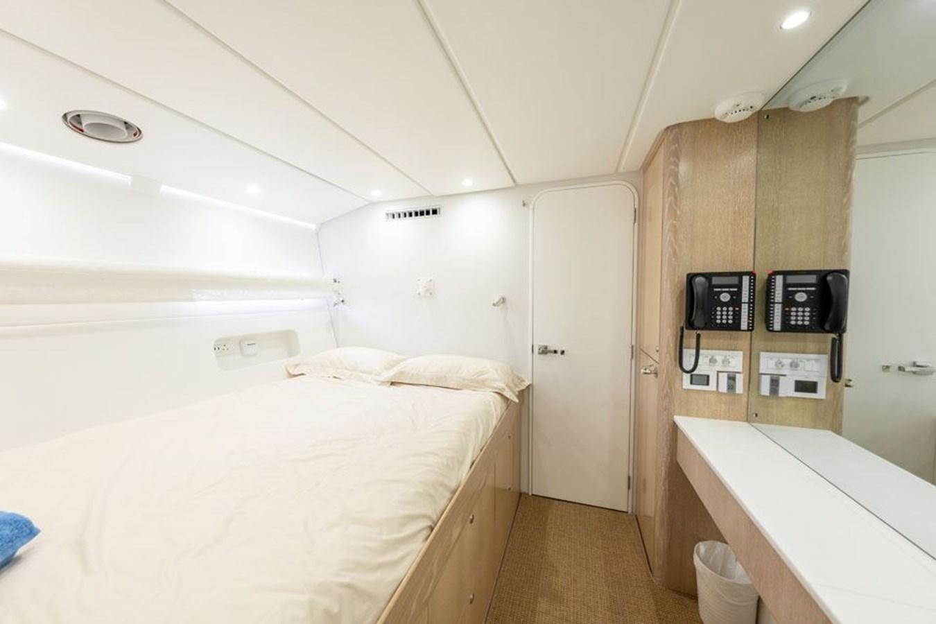a room with a bed and a closet aboard GREY WOLF Yacht for Sale