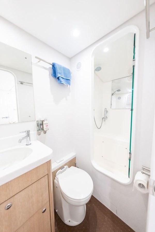 a bathroom with a toilet and sink aboard GREY WOLF Yacht for Sale