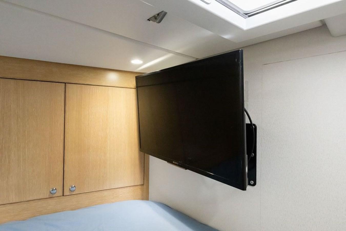 a black television on a wall aboard GREY WOLF Yacht for Sale
