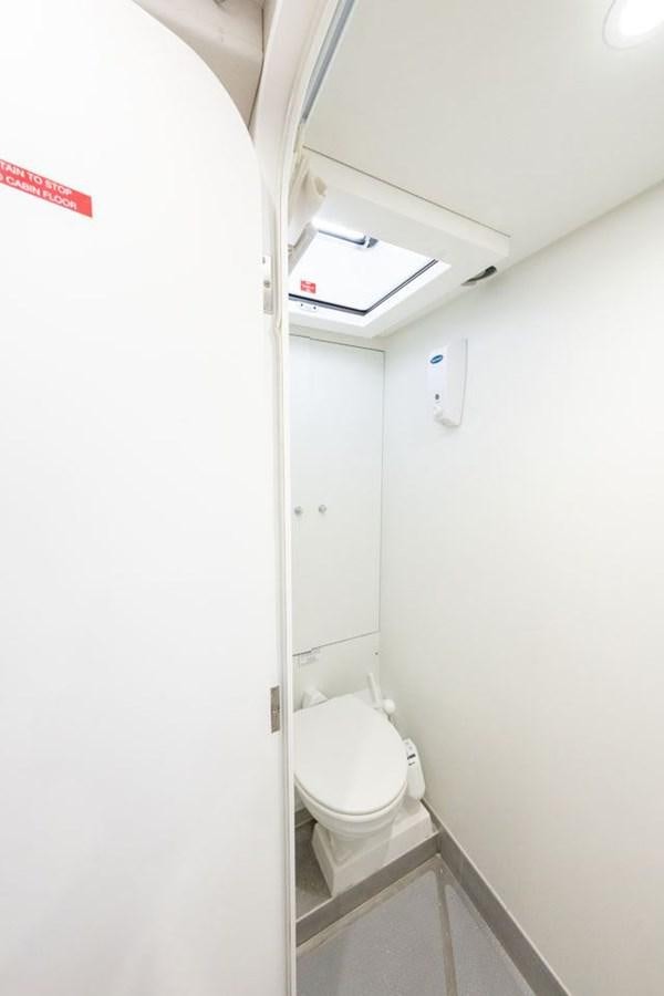 a toilet in a bathroom aboard GREY WOLF Yacht for Sale