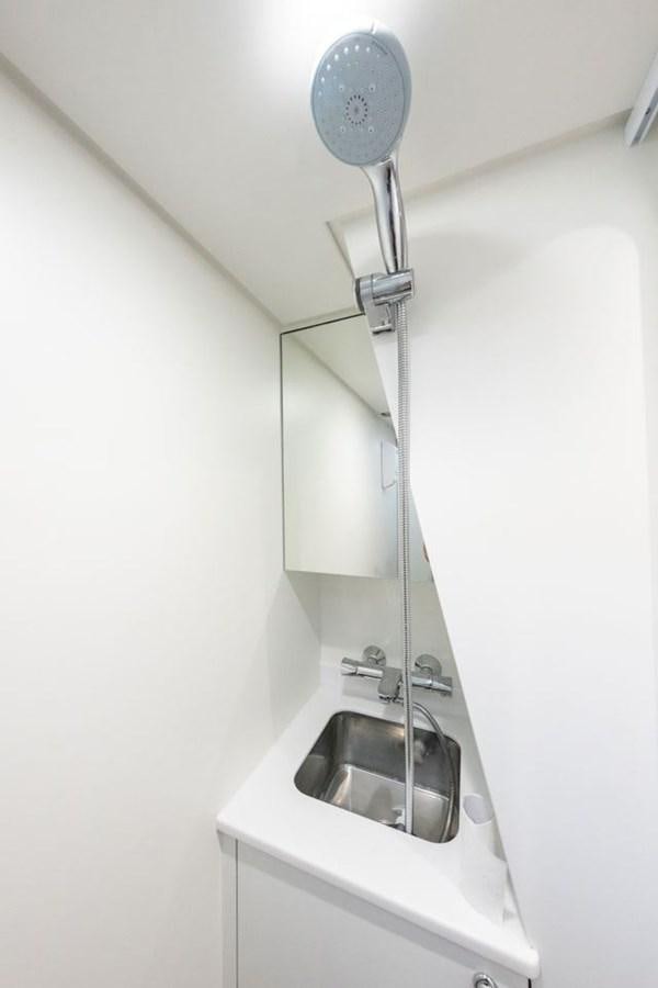 a silver sink in a white bathroom aboard GREY WOLF Yacht for Sale