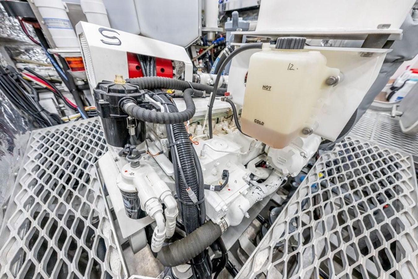 a car engine with a hood aboard GREY WOLF Yacht for Sale